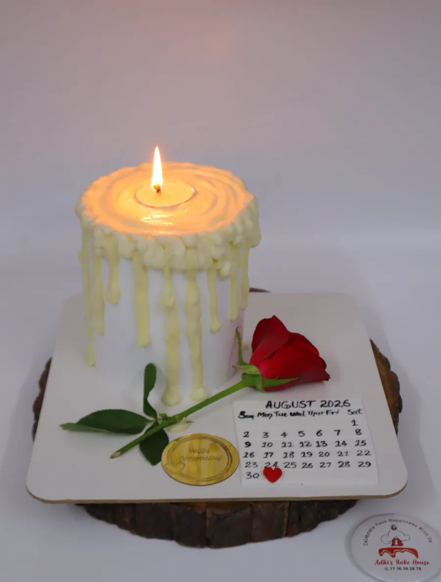 Cake shaped like a dripping candle with a calendar board and a red rose