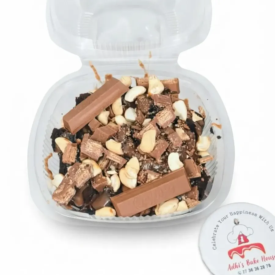Brownie tub topped with KitKat and cashews