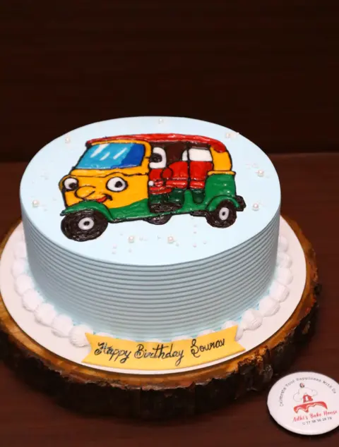 Cake with a hand-painted auto rickshaw