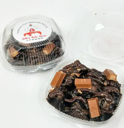 Brownie tub drizzled with chocolate and topped with Dairy Milk