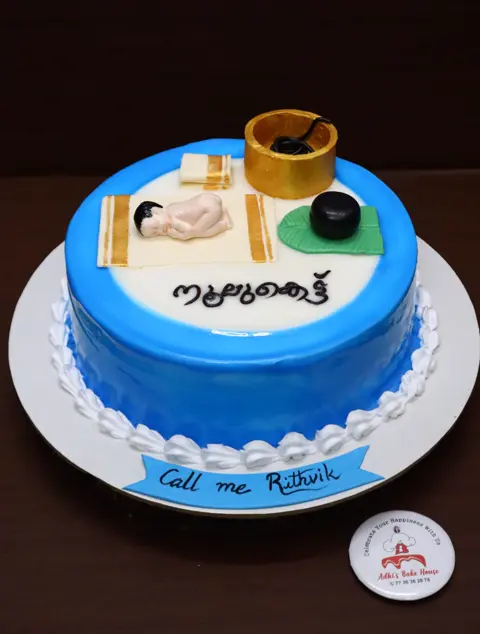 Blue personalised cake with hand-made fondant details