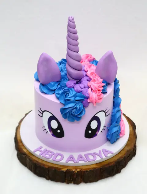 Purple pony unicorn cake with a buttercream mane