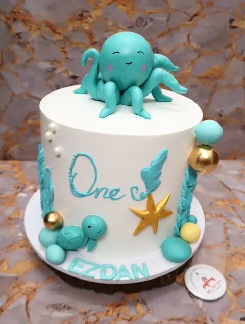 First birthday cake with an octopus, starfish and pearls