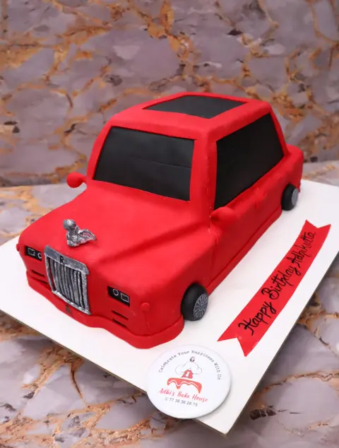 Sculpted red vintage car cake